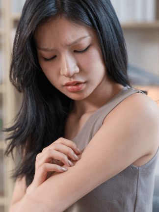 an asian girl looks like she's in discomfort