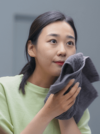 teenager girl is washing her face