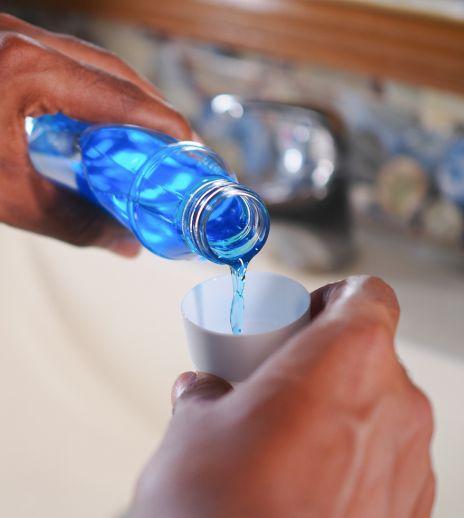 hand holding a mouthwash