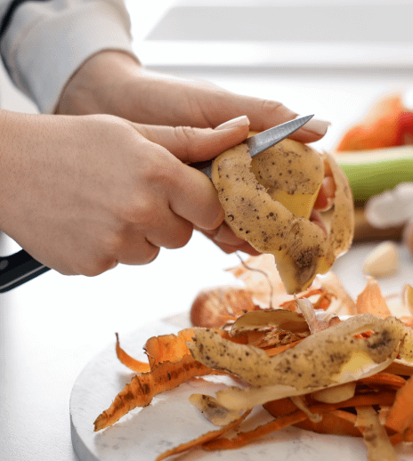 a hand cutting potatoes